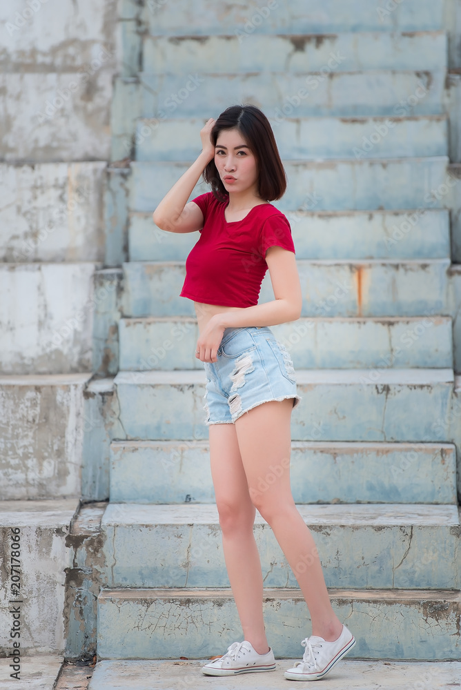 Portrait of asian woman sit on the road,Beautiful thailand people,Happy woman concept,Lifestyle of modern girl Portrait of asian woman sit on the road,Beautiful thailand people,Happy woman concept,Lifestyle of modern girl