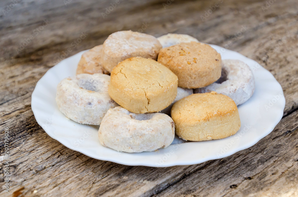 Mantecados and polvorones in a white plate Mantecados and polvorones in a white plate