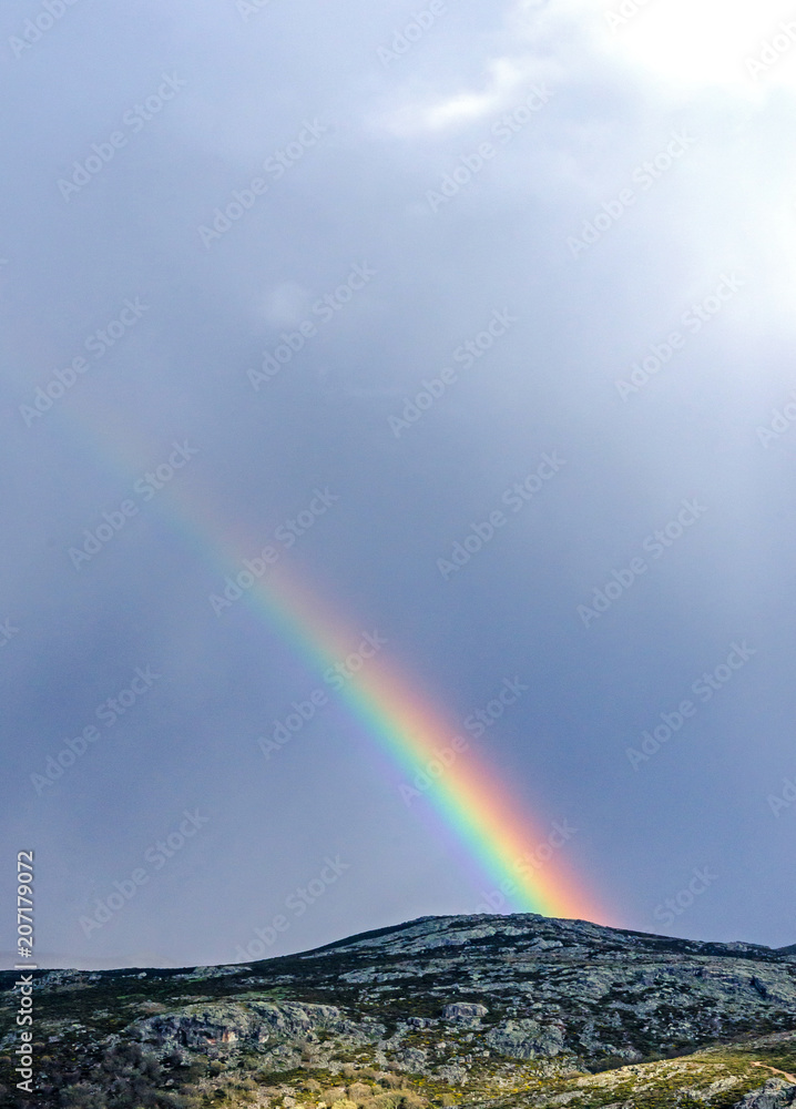 real rainbow on the mountain after the storm
