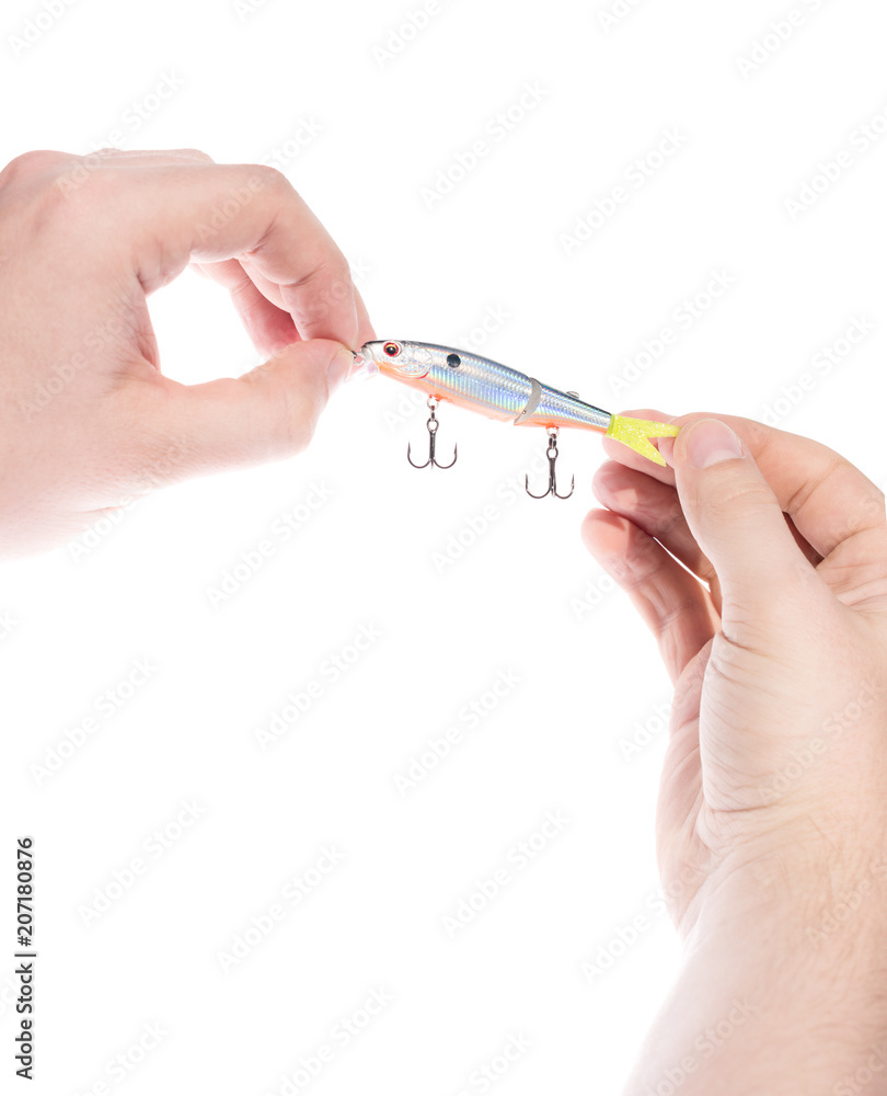 Closeup of male hands holding bait to fish with hooks. Isolated on white background. Closeup of male hands holding bait to fish with hooks. Isolated on white background.