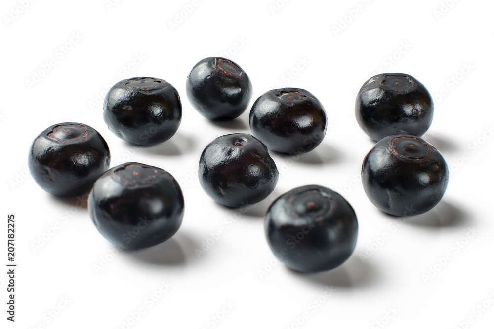 Couple of glossy wet blueberries isolated on white background. Couple of glossy wet blueberries isolated on white background.