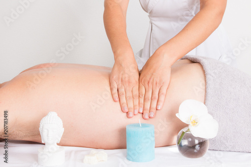man relaxing with woman hand massage at beauty spa