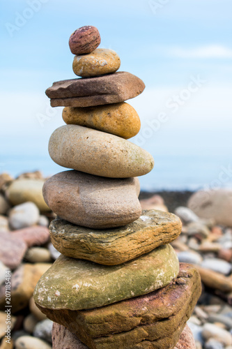 A rock pile or stack, with a blue sky as a background