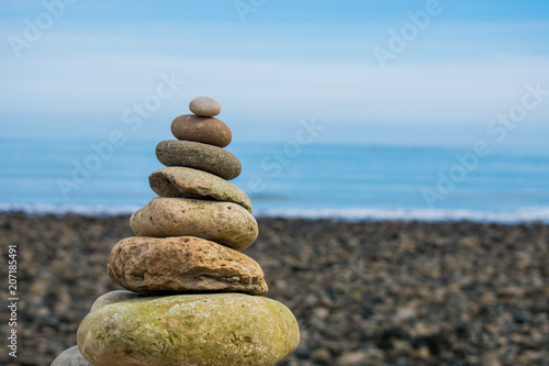 A rock pile or stack, with a blue sky as a background