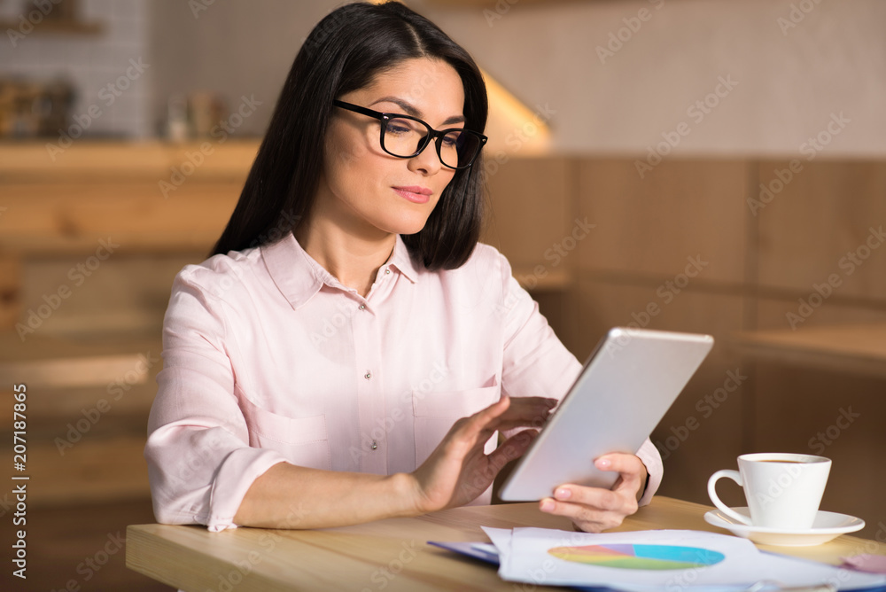 businesswoman using digital tablet in cafe businesswoman using digital tablet in cafe