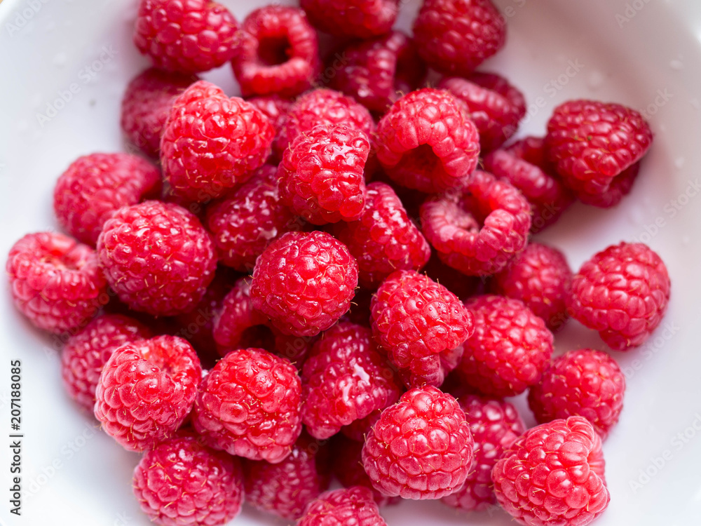 fresh raspberries in white bowl detail fresh raspberries in white bowl detail
