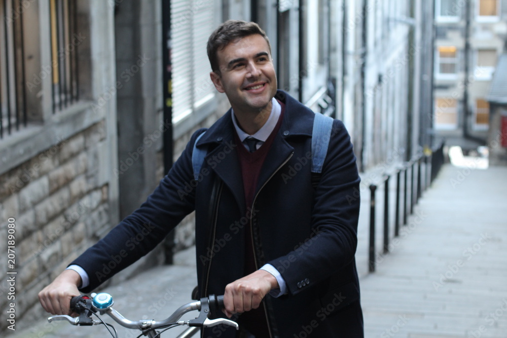 Smiley student heading to campus by bicycle Smiley student heading to campus by bicycle
