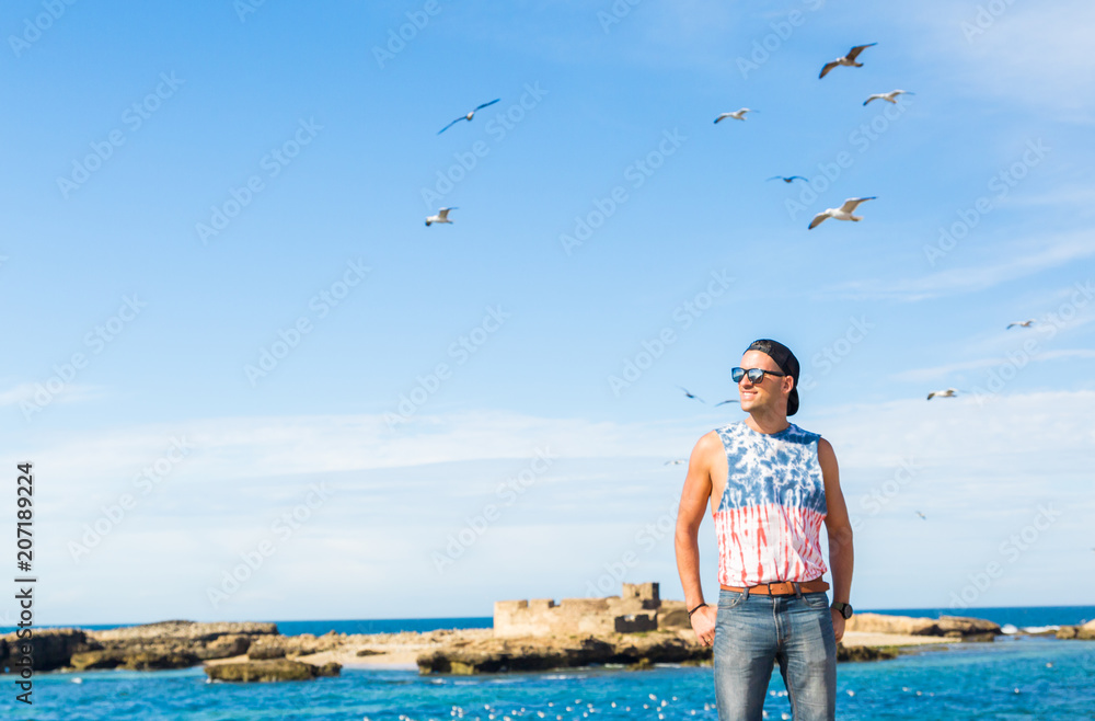 A model posing in the fishing port of Essaouira, Morocco