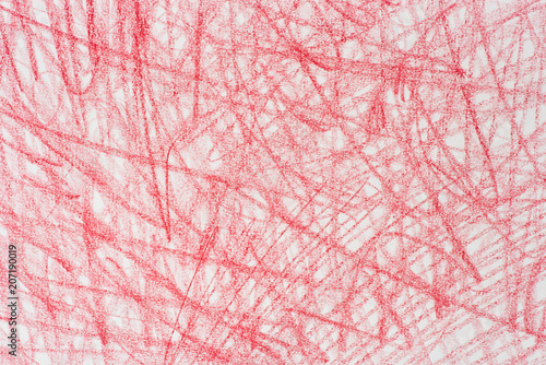 red crayon doodles on paper background texture