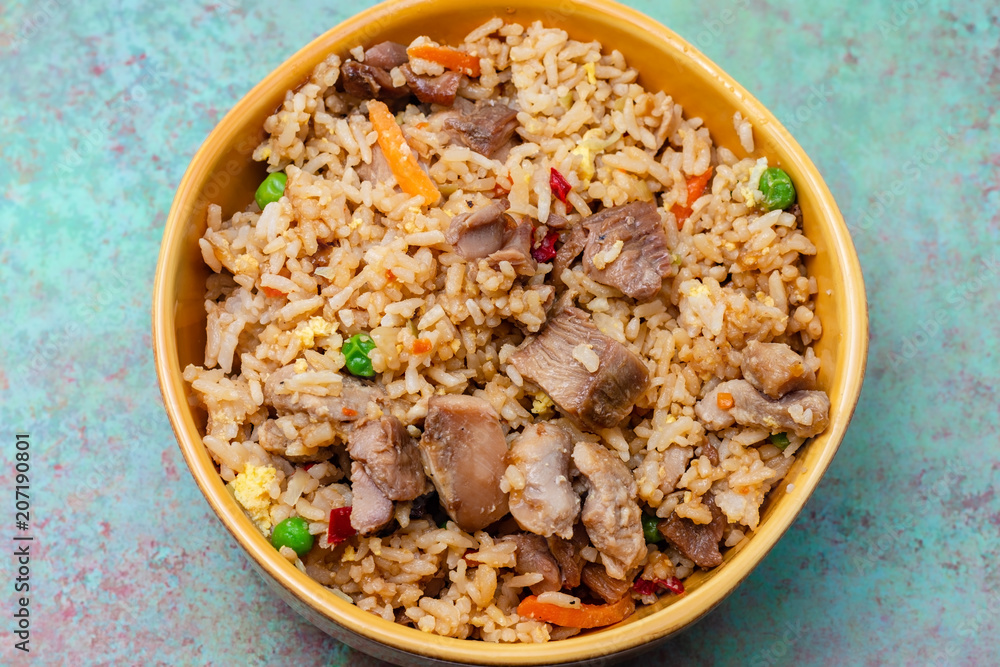 Top view of teriyaki chicken and fried rice on grunge background Top view of teriyaki chicken and fried rice on grunge background