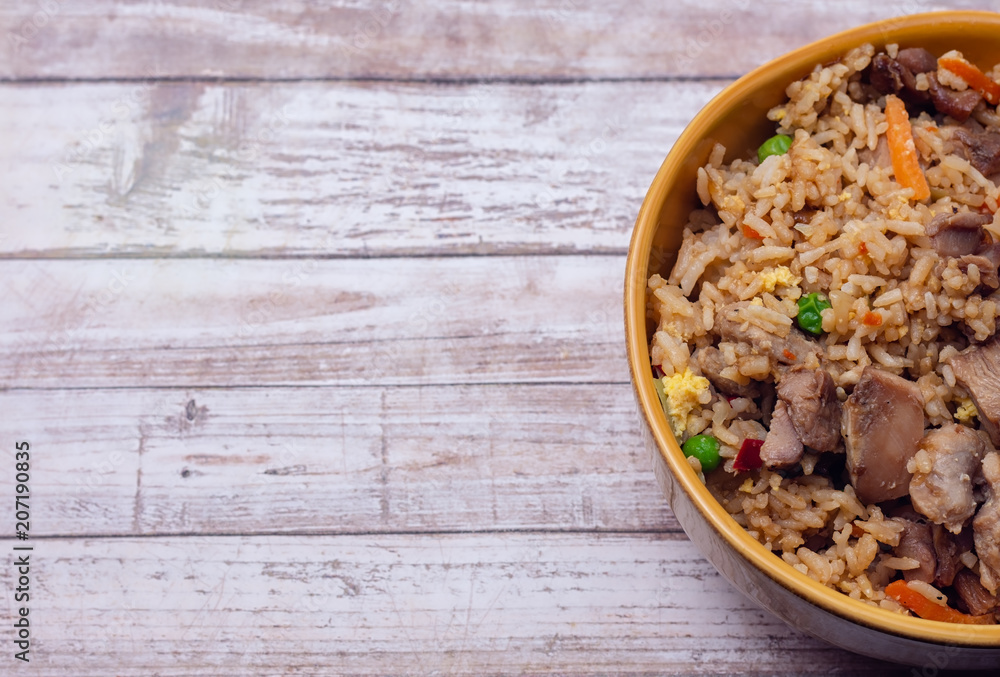 Teriyaki chicken and fried rice on wood table with room for copy text Teriyaki chicken and fried rice on wood table with room for copy text