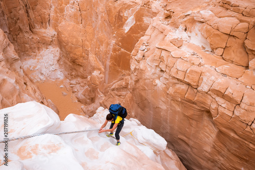 Woman climbing in White canyon, Sinai, Egypt