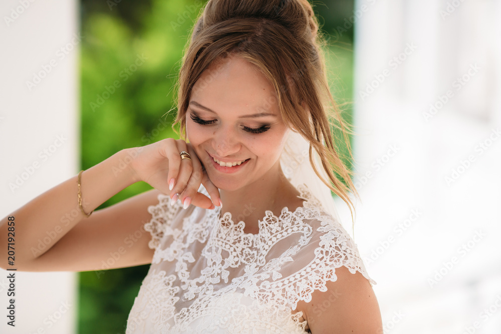 Portrait of the blonde bride, who is having fun and enjoying the wedding day. A girl in nature smiles and shows her beautiful eyes. Portrait of the blonde bride, who is having fun and enjoying the wedding day. A girl in nature smiles and shows her beautiful eyes.