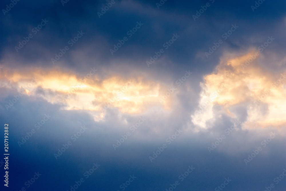 Background of the sky with clouds at sunset.