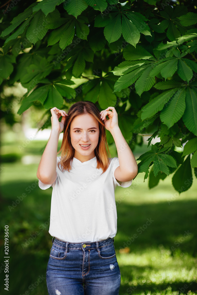 Beautiful girl in a green park.