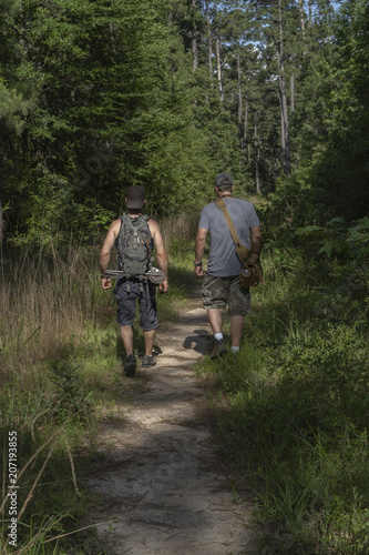 Two Male Hikers Going Into National Forest