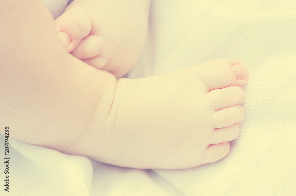 Top view of feet of newborn child. Concept of childbirth, medecine and gynecology. Instagram Top view of feet of newborn child. Concept of childbirth, medecine and gynecology. Instagram