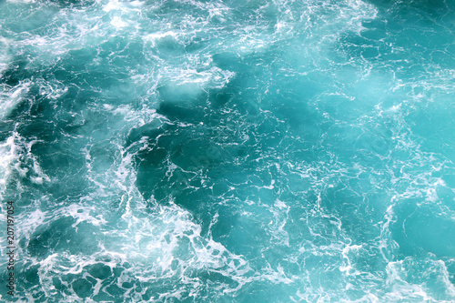 Beautiful turquoise sea with sea foam. 