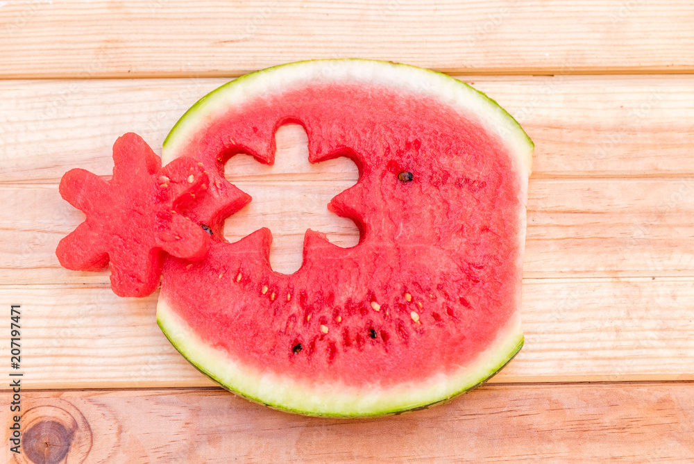 slices of watermelon on wooden table, mediterranean garden background slices of watermelon on wooden table, mediterranean garden background