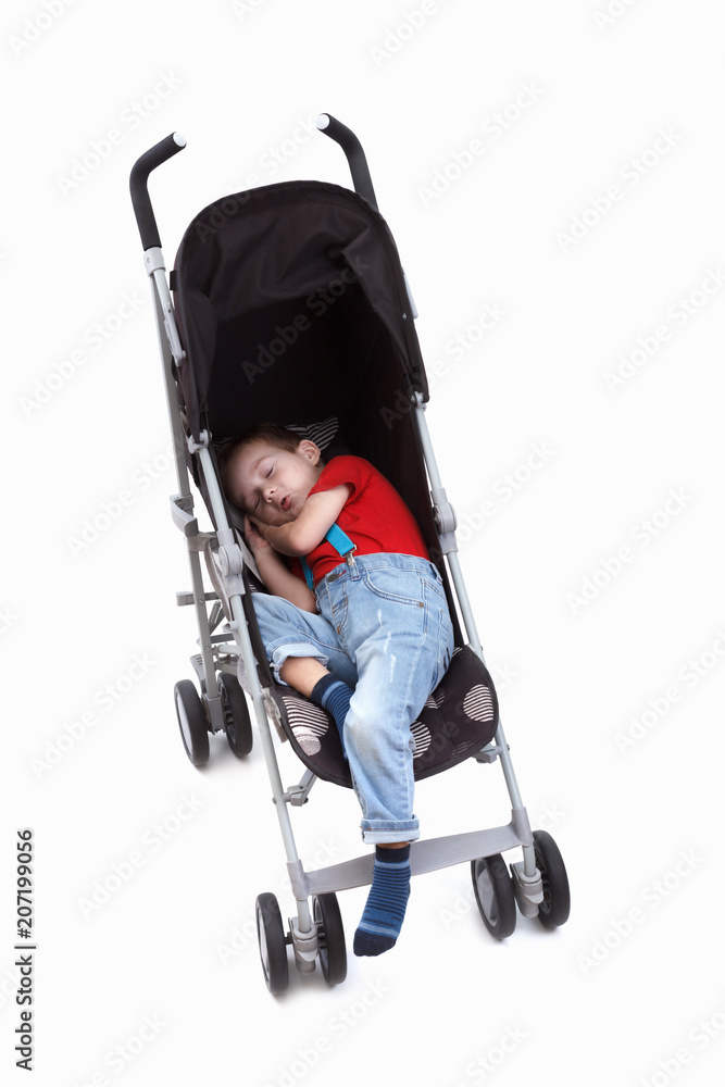 Happy baby boy in an stroller. On white. Happy baby boy in an stroller. On white.