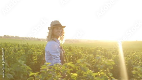 Woman artist painting with oil paints in a field photo