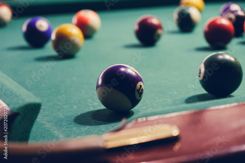 Billiard pockets and balls on a table