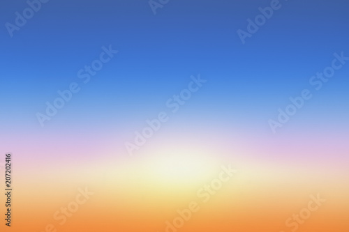 Sky gradient from blue to orange sunset © bravissimos