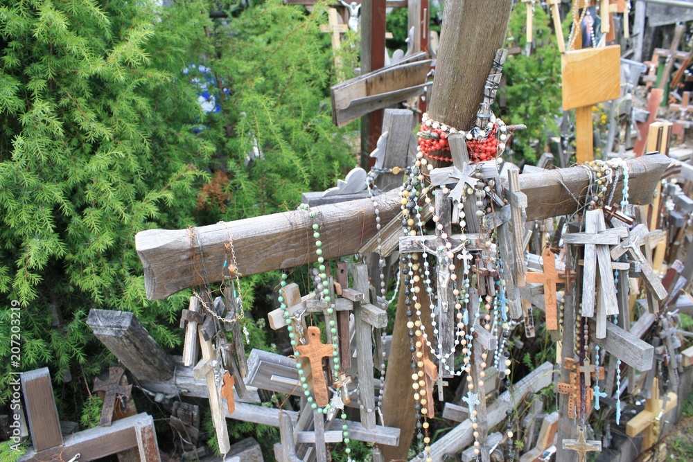 Rosaries draped on crosses at the Hill of Crosses
