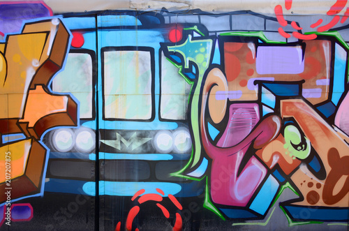 Fototapeta Sztuka uliczna. Obraz w tle abstrakcyjne fragmentu malowanego graffiti w modnych kolorach
