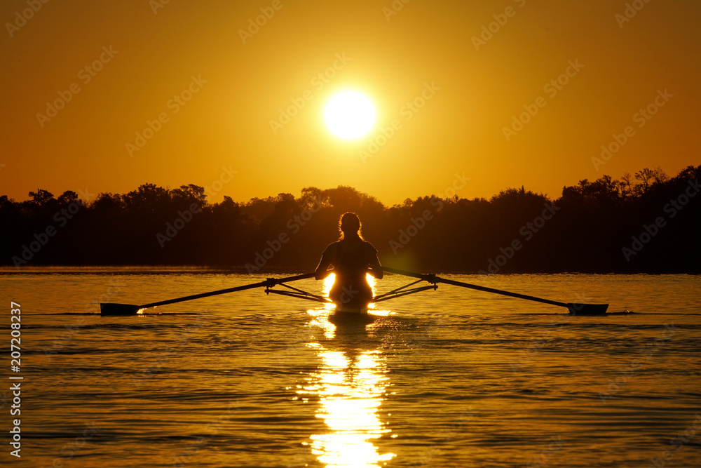 Rowing silhouette at sunrise on the river