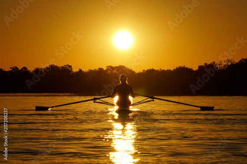 Rowing silhouette at sunrise on the river