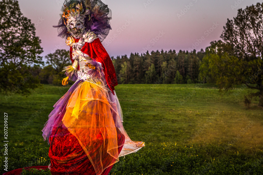 Fairy tale woman on stilts in bright fantasy stylization. Fine art outdoor photo. Fairy tale woman on stilts in bright fantasy stylization. Fine art outdoor photo.