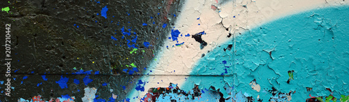 Street art. Abstract background image of a fragment of a colored graffiti painting in blue tones