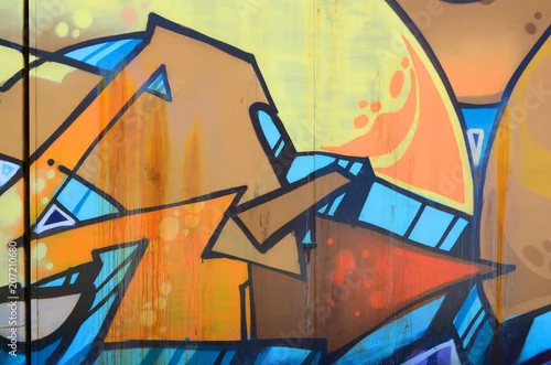 Obraz Sztuka uliczna. Abstrakcyjny obraz tła fragmentu kolorowego graffiti malowanego w odcieniach beżu i pomarańczy
