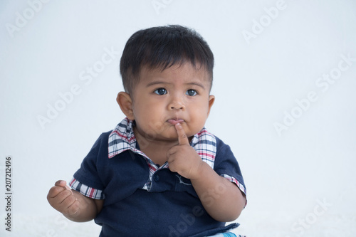 Asian little baby sitting and thinking