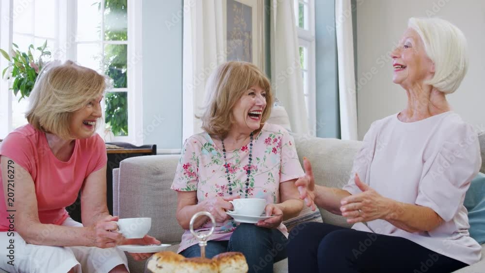 Senior Female Friends Enjoying Afternoon Tea At Home Together Senior Female Friends Enjoying Afternoon Tea At Home Together