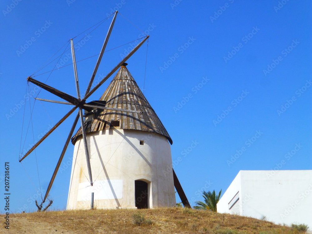Molino de viento de Las Negras, pueblo de pescadores del Parque Natural de  Cabo de Gata en Almeria (Andalucia,España). Stock Photo | Adobe Stock