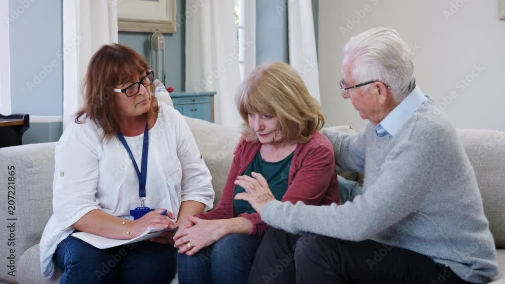 Support Worker Visits Senior Woman Suffering With Depression Support Worker Visits Senior Woman Suffering With Depression