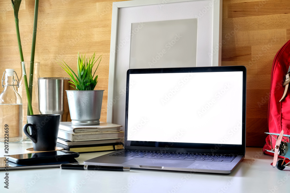 Student workspace laptop, books and mockup poster. Student workspace laptop, books and mockup poster.