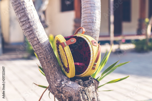 Natural organic handmade rattan handbag closeup. Yellow color. photo