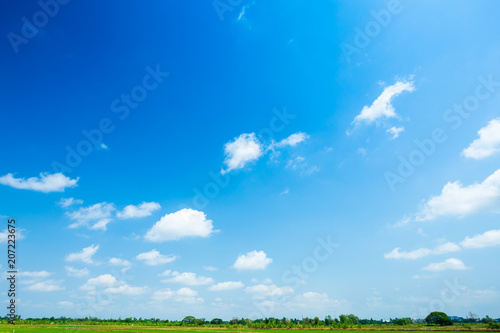 blue sky background with white clouds. © Thinapob