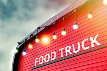 detail of closed red food truck with light bulb background, no people