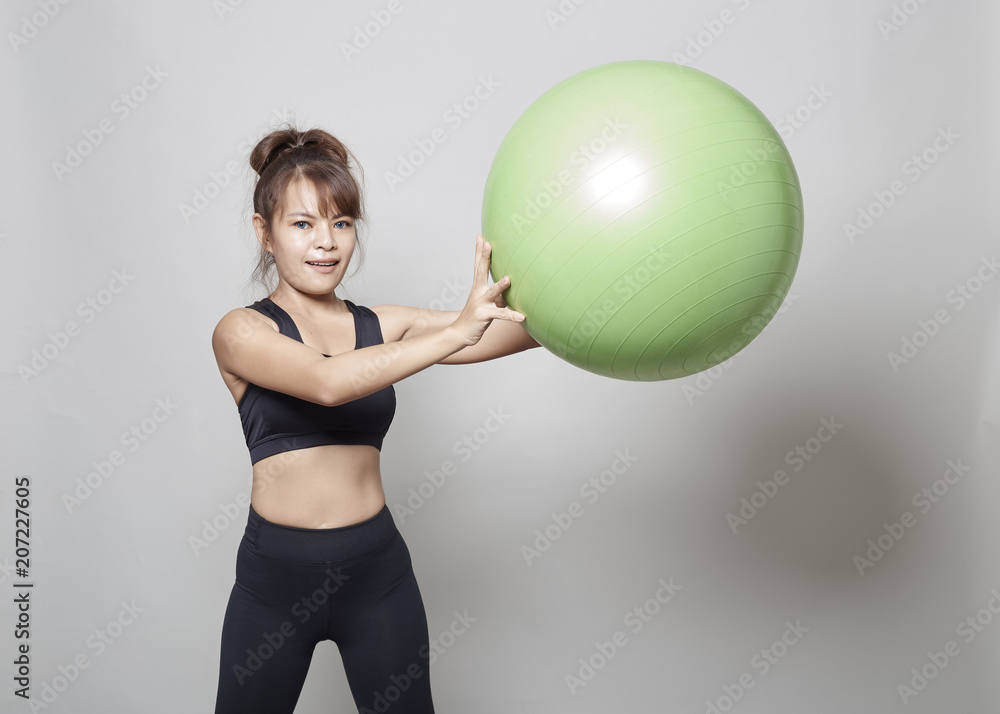 Sporty young woman training in gym Sporty young woman training in gym