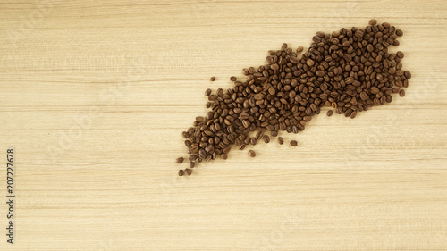 Coffee grinder with coffee beans on wooden background