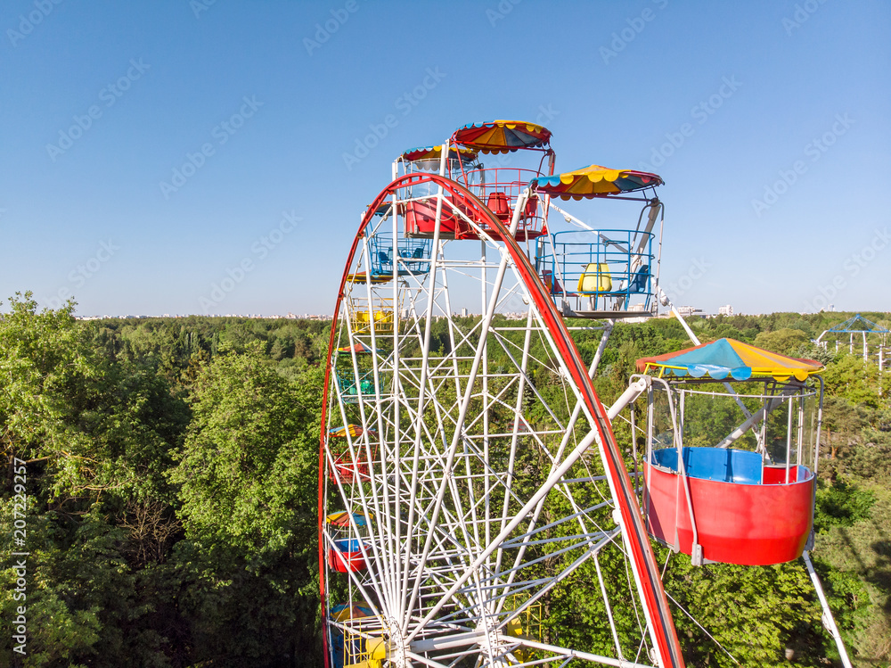 ferris wheel on blue sky background. cityscape panoramic view