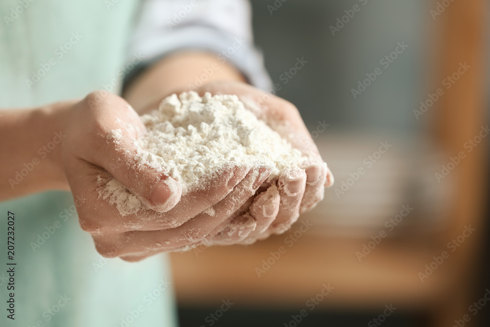 Woman holding flour, closeup Woman holding flour, closeup