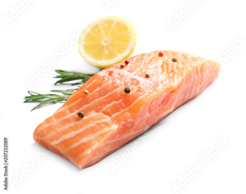 Fresh salmon with rosemary and lemon on white background