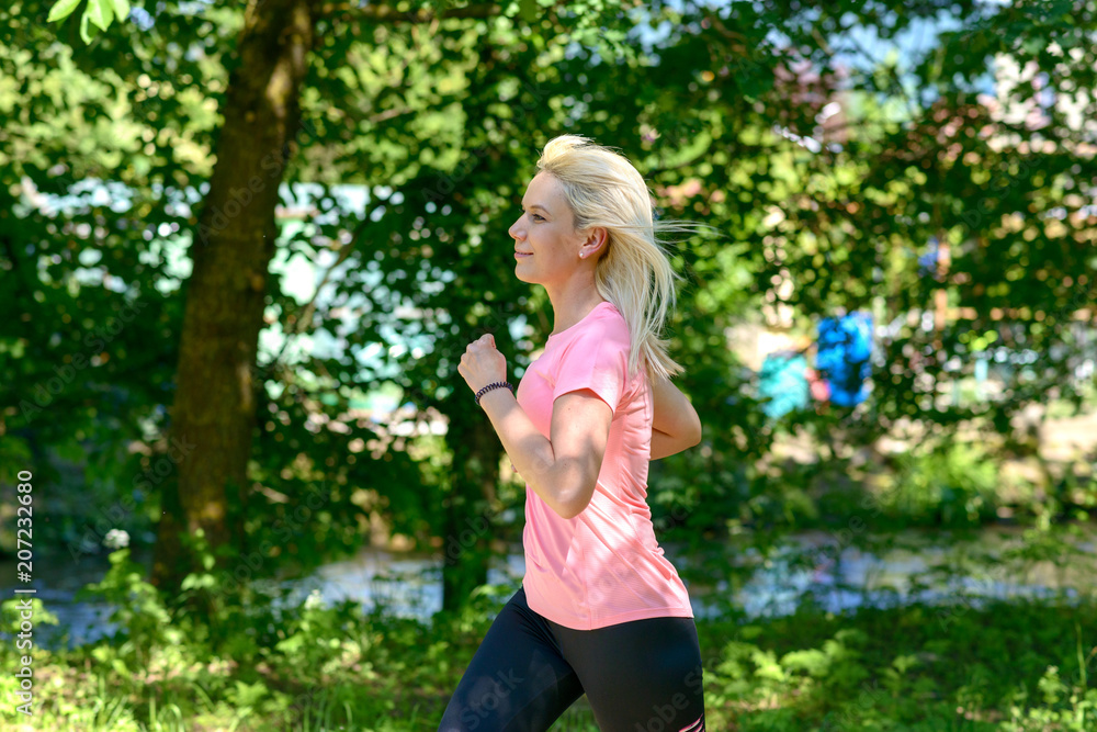 Young woman running in countryside Young woman running in countryside