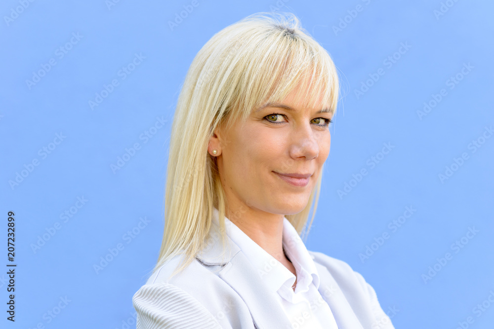 Young blond businesswoman with folded arms Young blond businesswoman with folded arms