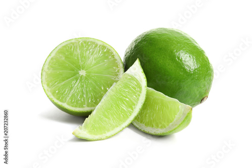 Fresh ripe green limes on white background